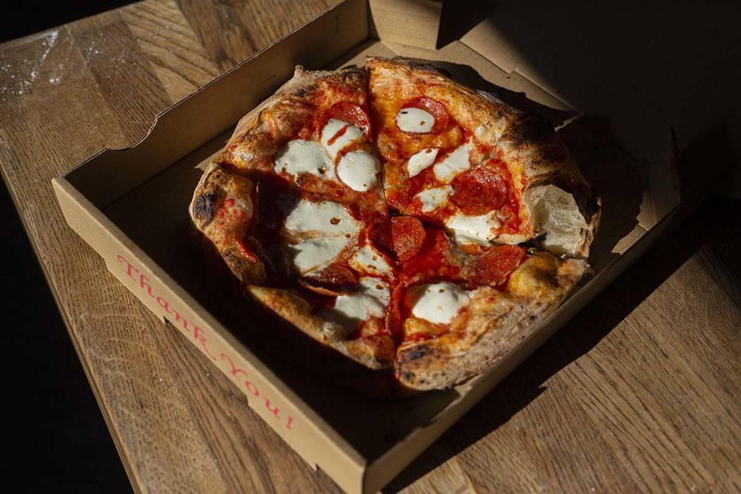 A Salami Gorgonzola pizza that cooked in 90 seconds, is ready to be served from Custom Pizza Tr ...