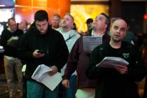 Bettors wait in line at the Westgate sportsbook on Thursday, Jan. 23, 2020, in Las Vegas. (Benj ...