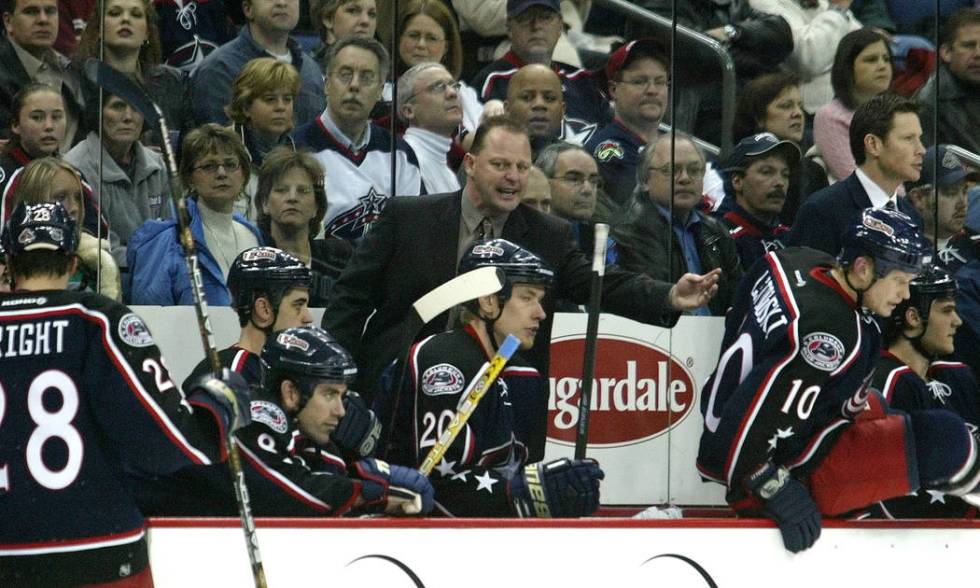 ** FILE ** Columbus Blue Jackets interim coach Gerard Gallant, center, gestures from behind the ...