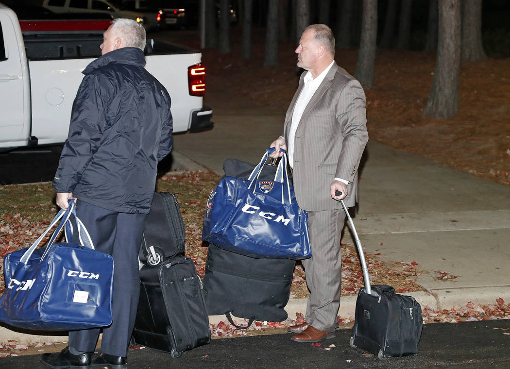 Gerard Gallant, right, former Florida Panthers head coach, waits for a cab after being relieved ...
