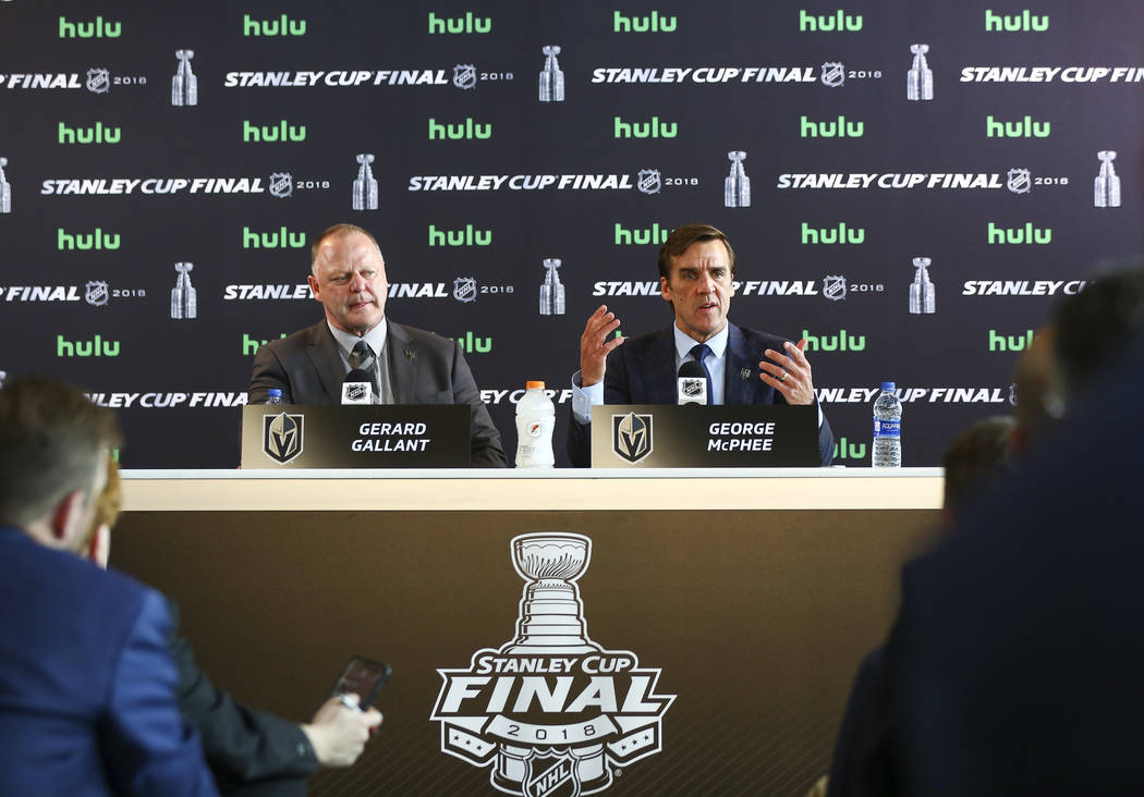 Golden Knights head coach Gerard Gallant, left, looks on as George McPhee, general manager of t ...