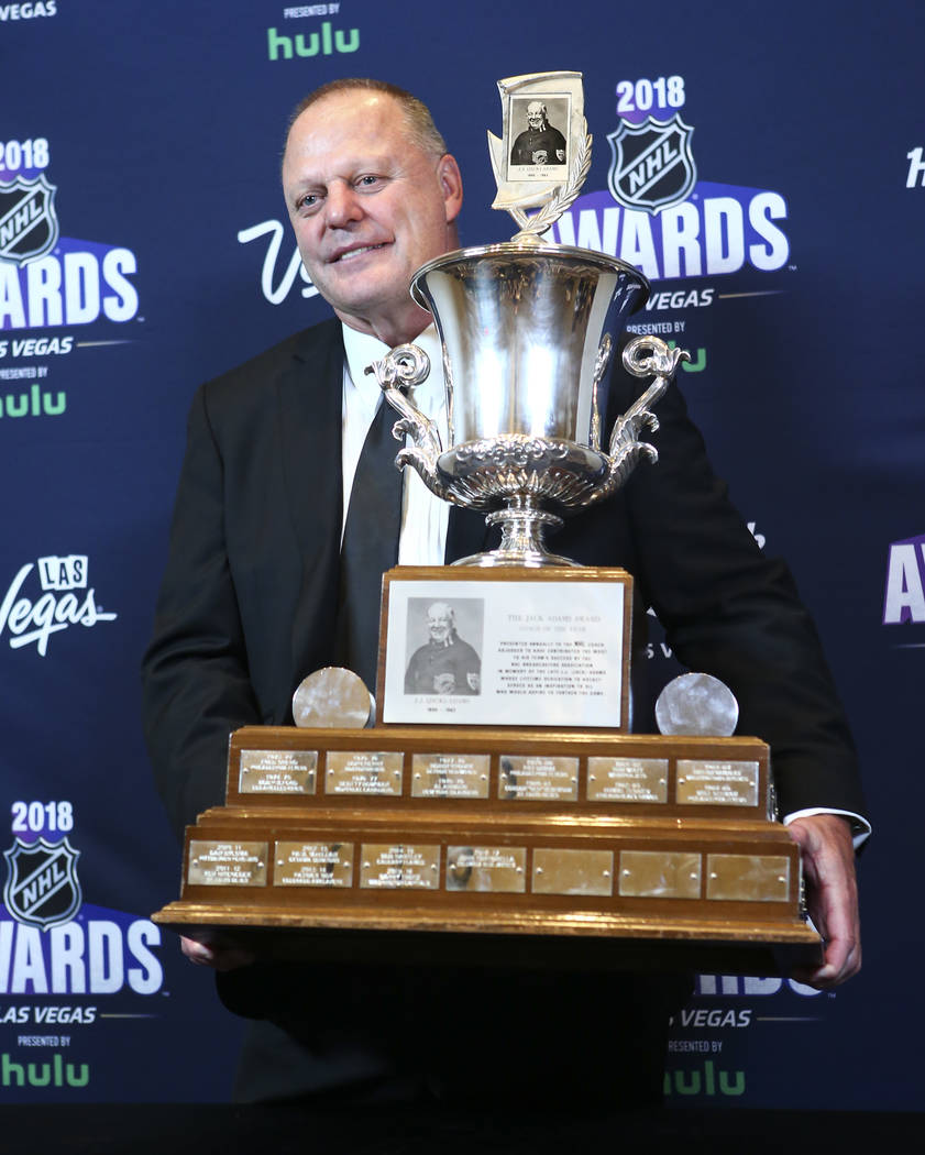 Golden Knights head coach Gerard Gallant poses with the Jack Adams Award during the NHL Awards ...