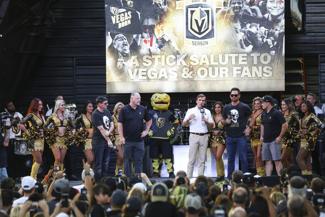George McPhee, general manager of the Golden Knights, center right, addresses the crowd alongsi ...