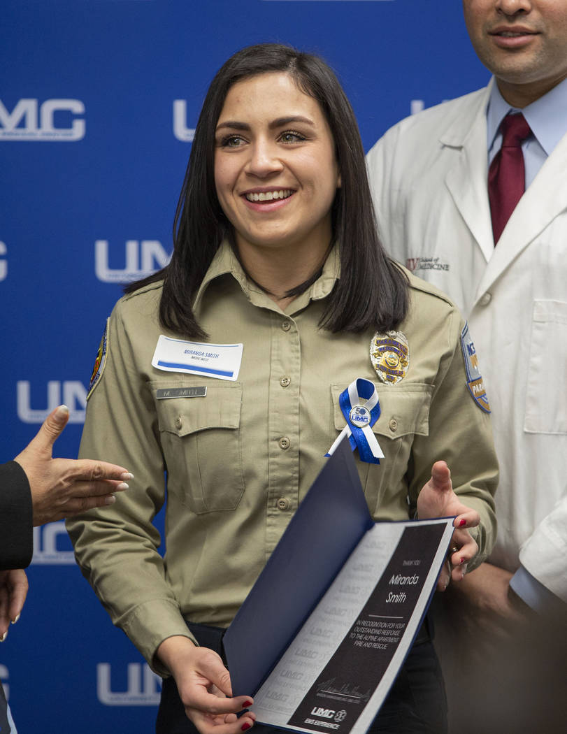 Miranda Smith, paramedic with MedicWest, receives a certificate of appreciation, alongside of e ...