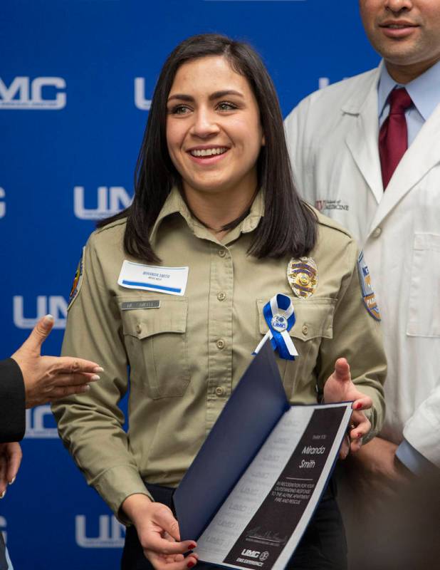 Miranda Smith, paramedic with MedicWest, receives a certificate of appreciation, alongside of e ...