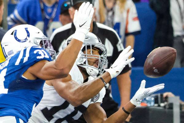 Oakland Raiders wide receiver Tyrell Williams (16) makes a catch for a touchdown in front of In ...