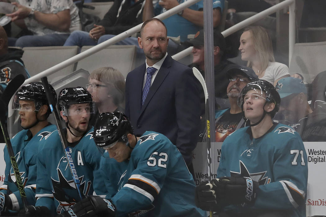 San Jose Sharks head coach Peter DeBoer, top, watches the second period of an NHL preseason hoc ...