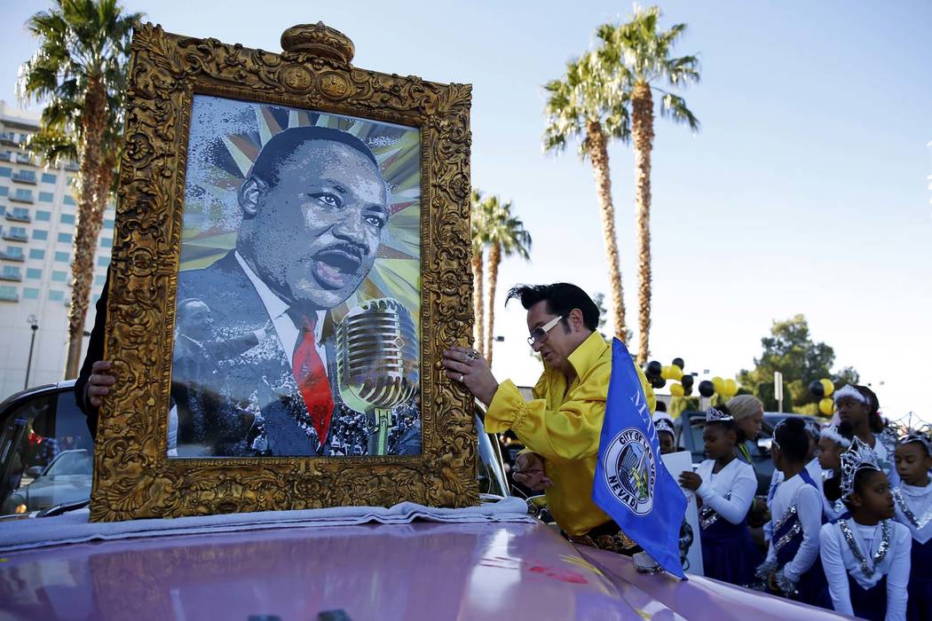 Jesse Garon prepares for the 36th annual Dr. Martin Luther King Jr. Parade, themed "Living the ...