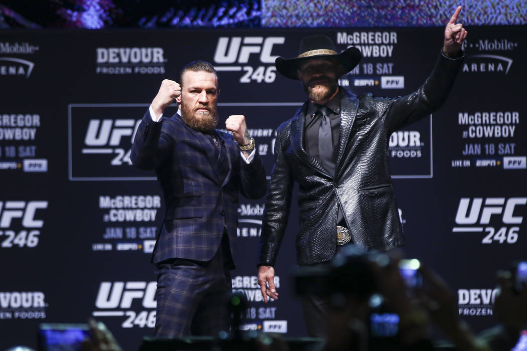 Conor McGregor, left, and Donald ÒCowboyÓ Cerrone pose for pictures during a press co ...