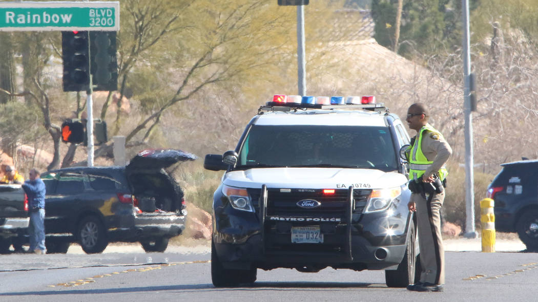 Las Vegas police investigate near Rainbow Boulevard and Darby after an officer-involved shootin ...