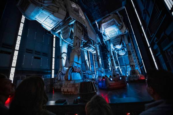 Guests race past massive AT-AT walkers aboard a First Order Star Destroyer as part of "Star War ...