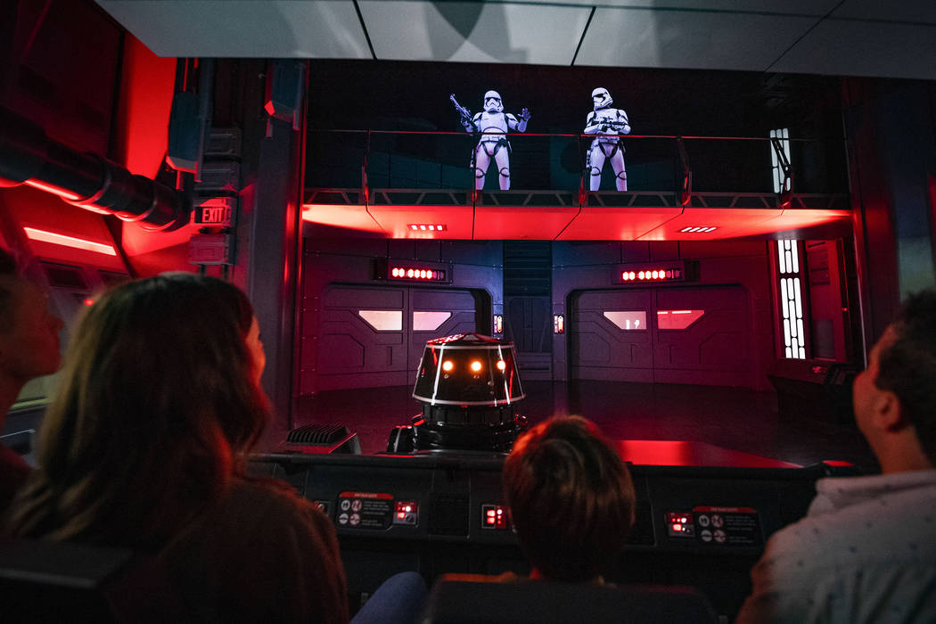 Guests flee First Order Stormtroopers onboard a Star Destroyer as part of Star Wars: Rise of th ...