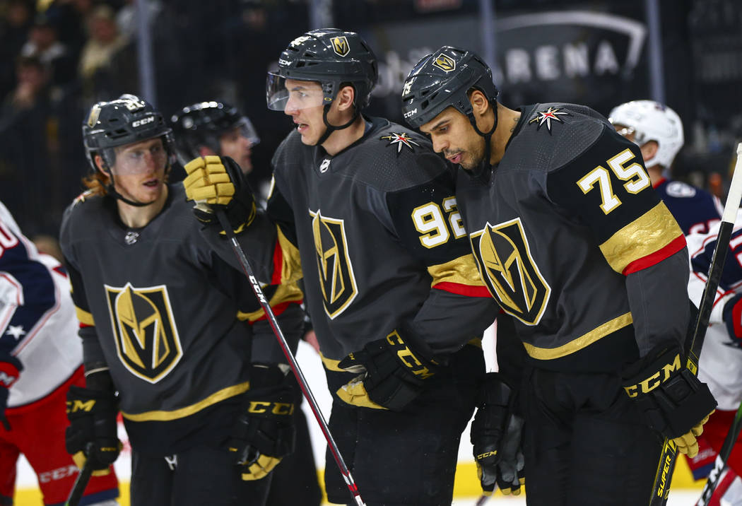 Golden Knights' Ryan Reaves (75) reacts alongside teammates Cody Eakin (21) and Tomas Nosek (92 ...