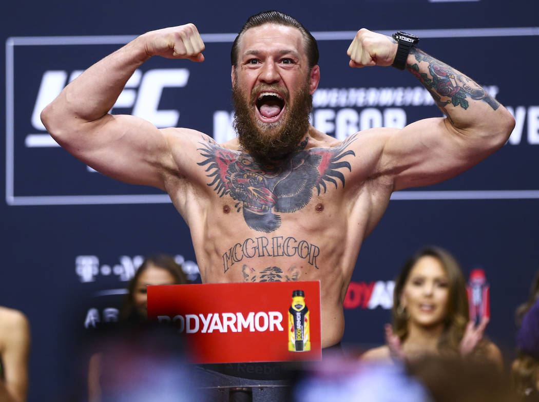 Conor McGregor poses during the ceremonial weigh-in event for UFC 246 in Las Vegas on Friday, J ...