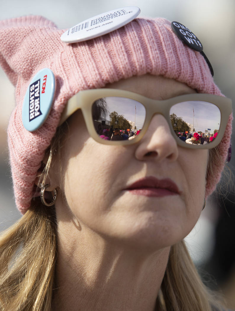 The Empowering Women March 2020 is reflected in the sun glasses of Jenna Hughes of Las Vegas on ...