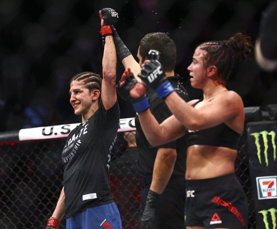 Roxanne Modafferi, left, celebrates her unanimous decision victory over Maycee Barber during th ...
