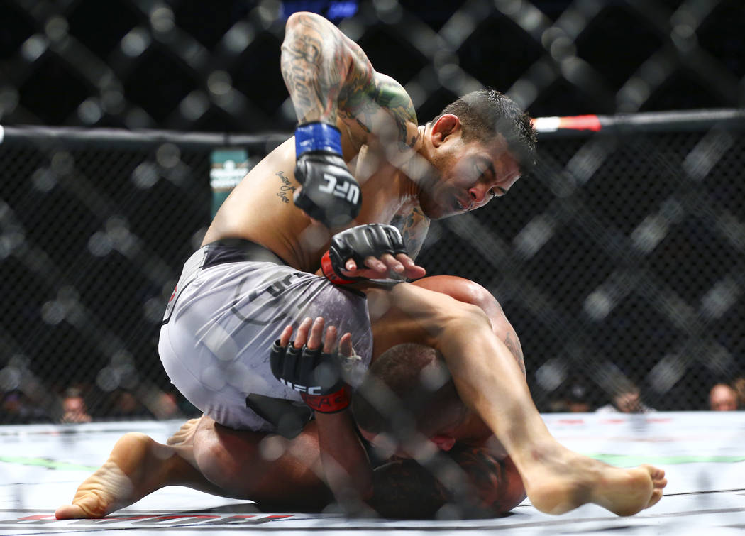 Diego Ferreira, above, fights Anthony Pettis during their lightweight bout at UFC 246 at T-Mobi ...
