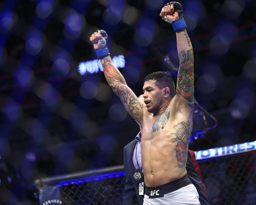 Diego Ferreira celebrates after defeating Anthony Pettis via submission in their lightweight bo ...