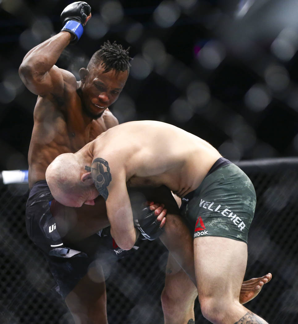 Brian Kelleher, right, takes Ode' Osbourne to the mat during their bantamweight bout at UFC 246 ...