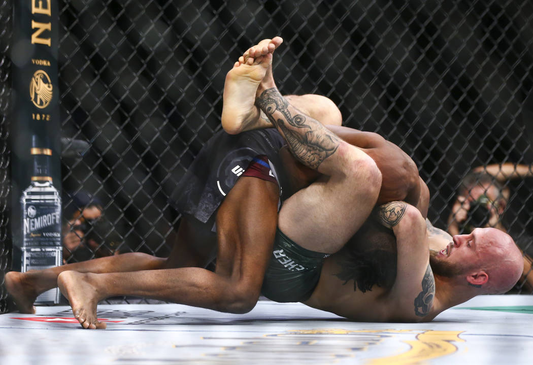 Brian Kelleher, right, defeats Ode' Osbourne via rear-naked choke submission in their bantamwei ...