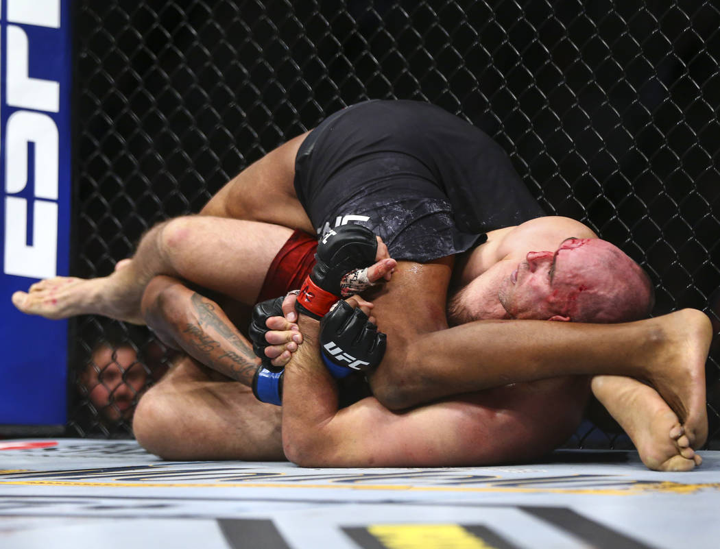 Aleksei Oleinik, right, defeats Maurice Greene via submission in their heavyweight bout at UFC ...