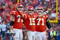 Kansas City Chiefs' Patrick Mahomes (15) celebrates a touchdown pass with Eric Fisher (72) and ...