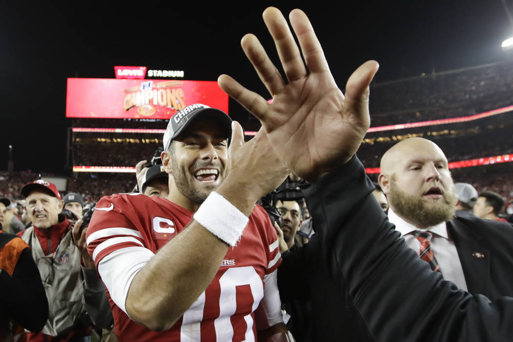 San Francisco 49ers quarterback Jimmy Garoppolo celebrates after their win against the Green Ba ...
