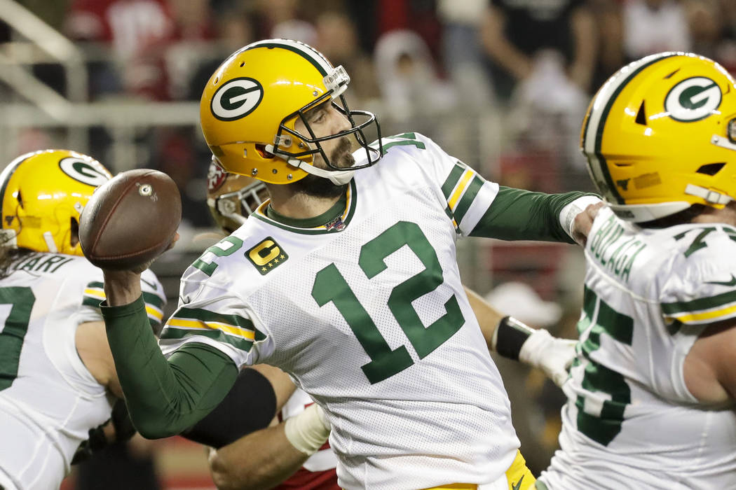 Green Bay Packers quarterback Aaron Rodgers passes against the San Francisco 49ers during the s ...