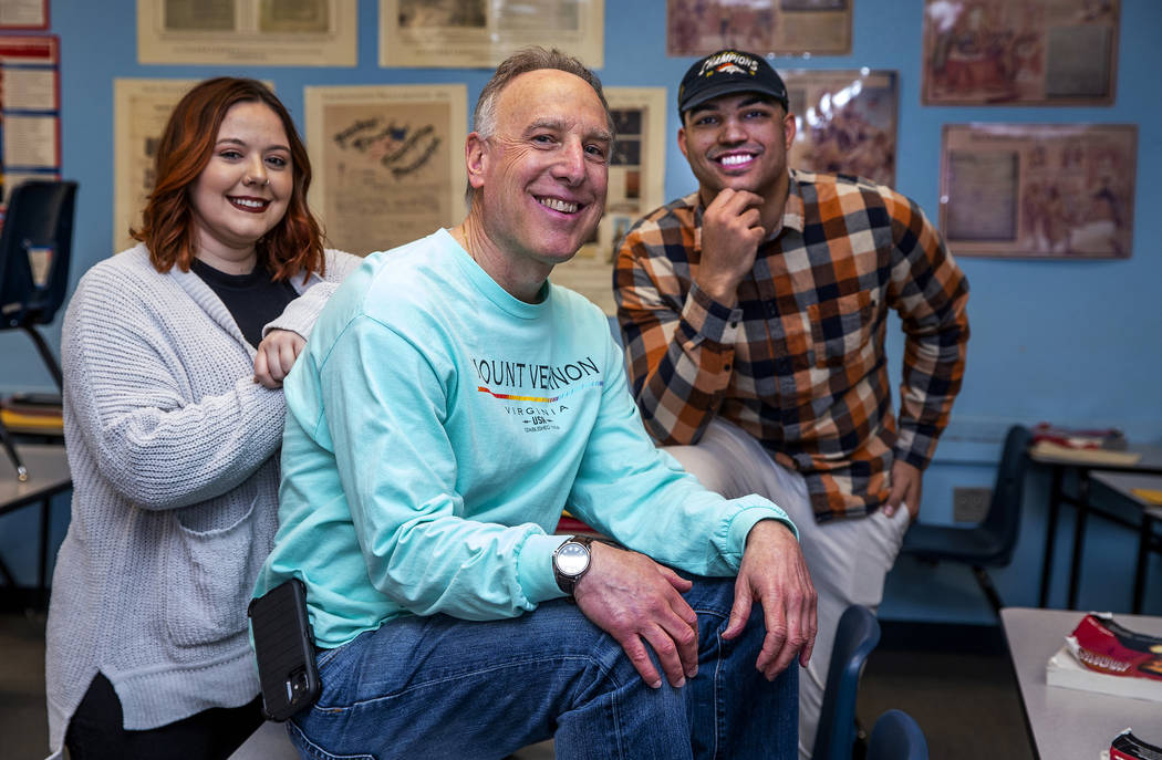 Leavitt Middle School Holocaust teacher Mitchell Kalin, center, with former students Tiara Simp ...