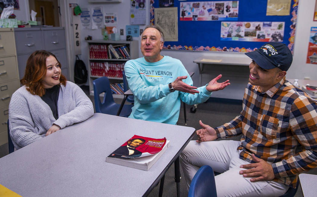 Leavitt Middle School Holocaust teacher Mitchell Kalin, center, talks about their class experie ...