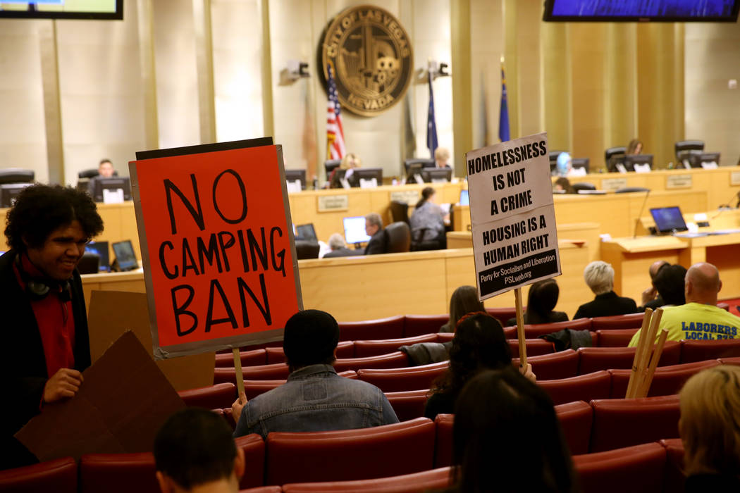 Samuel Blasco and Annelise Friedman, both of Las Vegas, wait for the start of a Las Vegas City ...