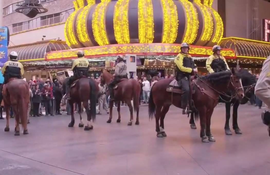 Las Vegas police stand guard Monday, Jan. 20, 2020, in downtown Las Vegas. Activists gathered o ...