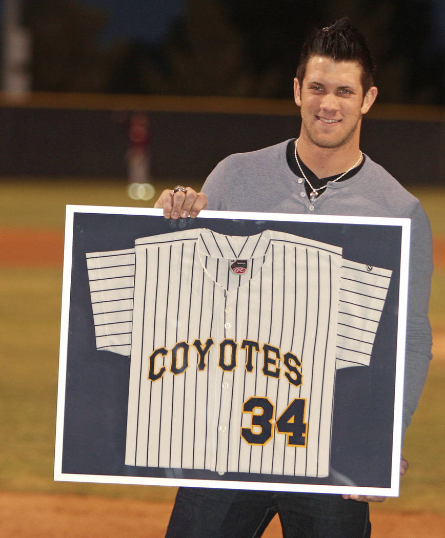 Bryce Harper holds up his CSN jersey during a retirement ceremony for himself the top pick in d ...