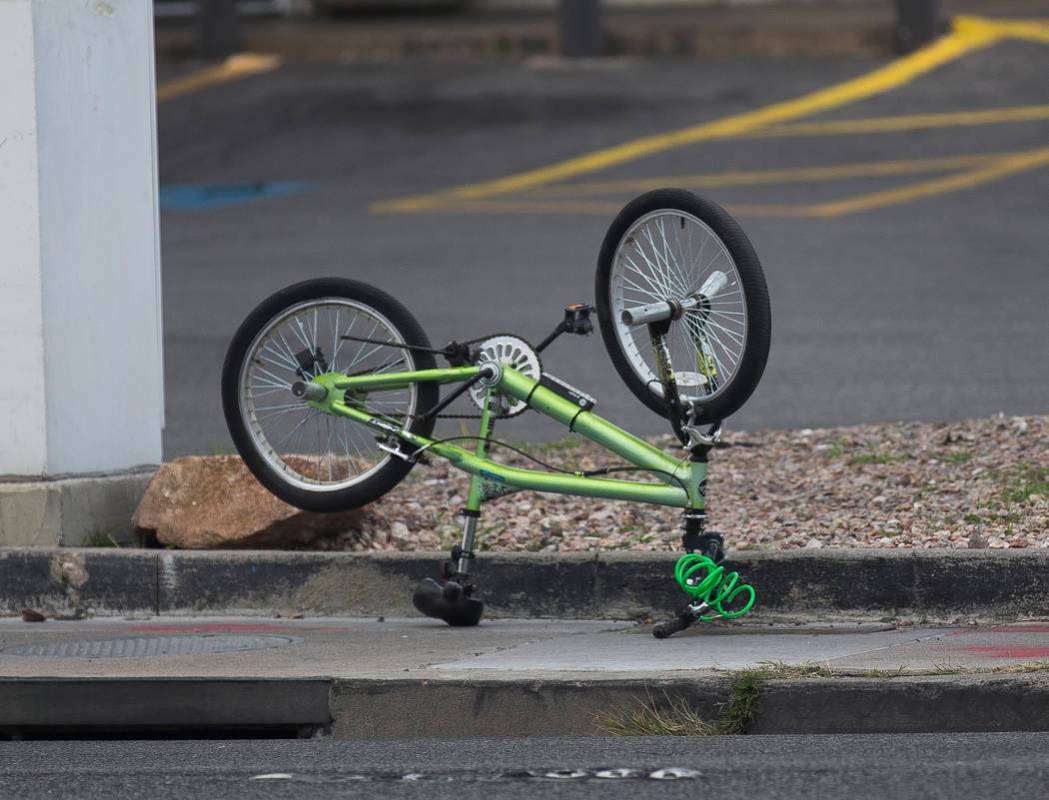 The bike of the 12-year-old boy that was struck by a car and seriously injured while riding on ...