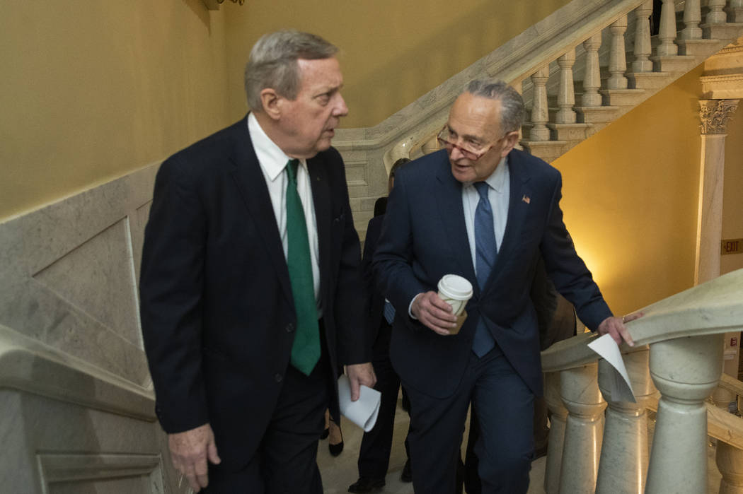 Democratic leader Sen. Chuck Schumer, D-N.Y., right, and Sen. Dick Durbin, D-Ill., walk on the ...