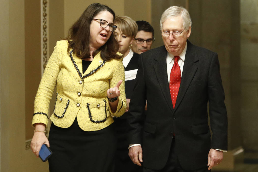 Senate majority leader, Sen. Mitch McConnell, R-Ky., right, walks back to the Senate chamber at ...