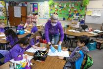 Kindergarteners participate in a class activity led by their teacher Nikki McGuire at Staton El ...