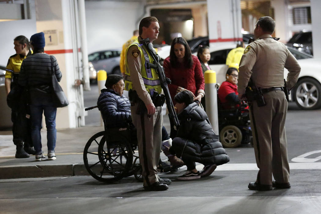 Armed police officers stand in front of the Nordstrom parking lot at Fashion Show mall in Las V ...