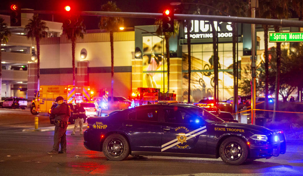 A Nevada State Trooper man's a Fashion Show Mall entrance near Dick's Sporting Goods while it i ...