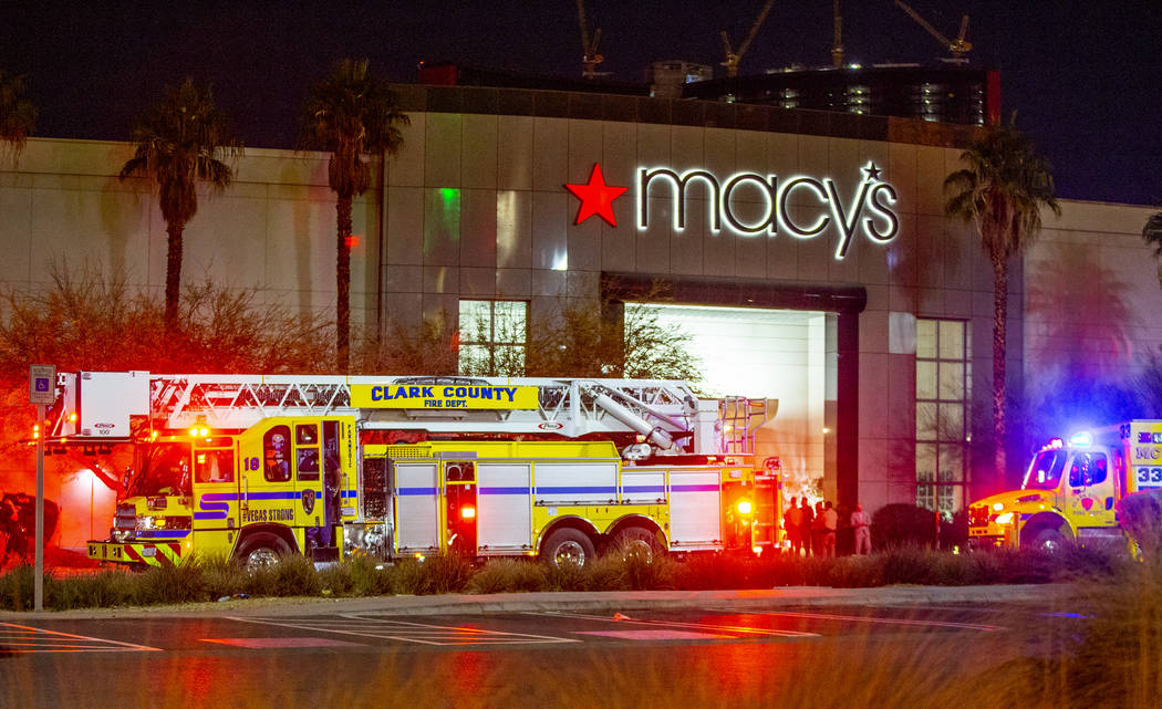 Metropolitan Police Department officers stage at a Fashion Show Mall entrance near Macy's for a ...