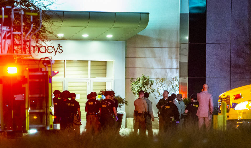 Metropolitan Police Department officers stage at a Fashion Show Mall entrance near Macy's for a ...