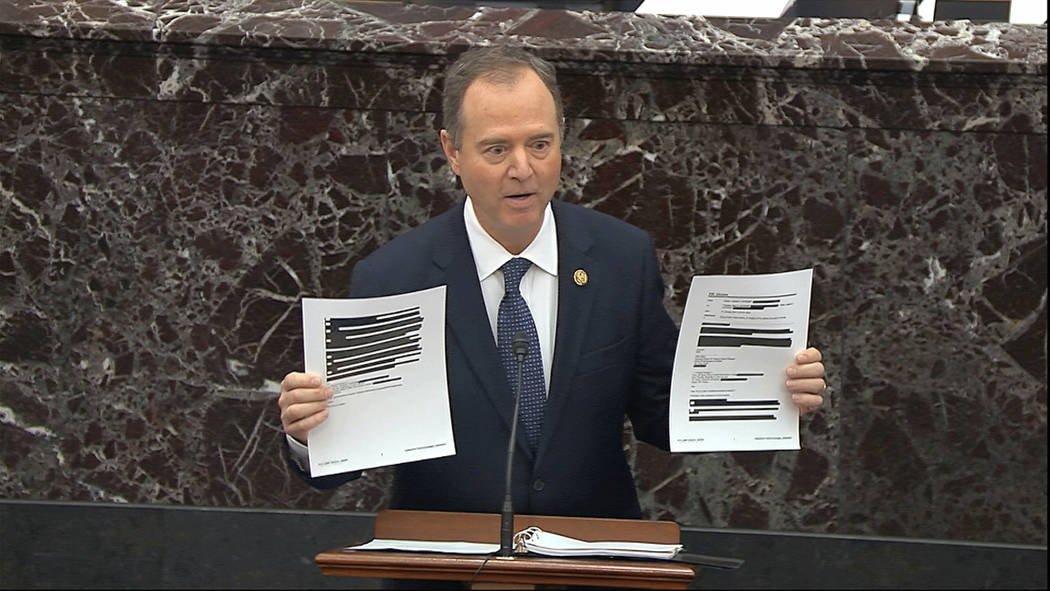 In this image from video, House impeachment manager Rep. Adam Schiff, D-Calif., holds redacted ...