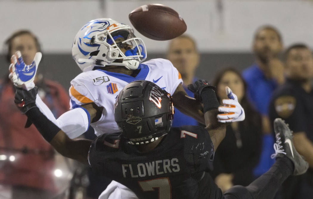 Boise State Broncos wide receiver John Hightower (16) fights for a deflected pass with UNLV Reb ...