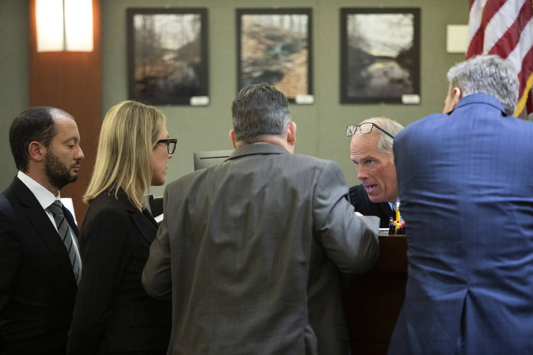 Chief Deputy District Attorneys Christopher Hamner, left, Michelle Fleck, second from left, def ...