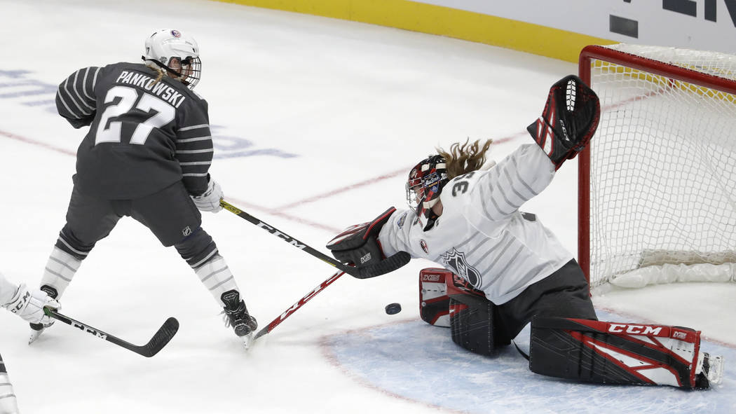 Canada goalie Ann-Renee Desbiens (35) stops a United States' Annie Pankowski (27) shot during t ...