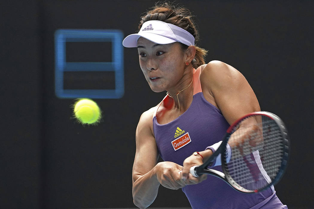 China's Wang Qiang returns a backhand to Serena Williams of the U.S. in their third round singl ...