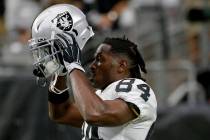 Oakland Raiders wide receiver Antonio Brown (84) puts on his helmet prior to a game against the ...