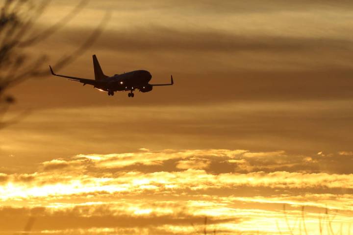 A Southwest Airlines plane approaches McCarran International Airport during sunrise on Friday, ...