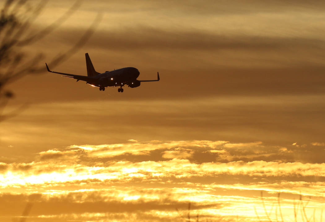 A Southwest Airlines plane approaches McCarran International Airport during sunrise on Friday, ...