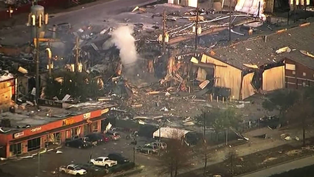 This aerial photo taken from video provided by KTRK-TV shows damage to buildings after an explo ...